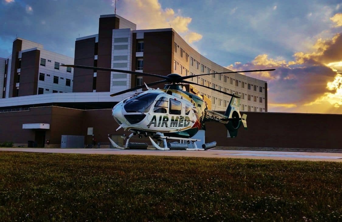 An Air Med helicopter in front of a hospital