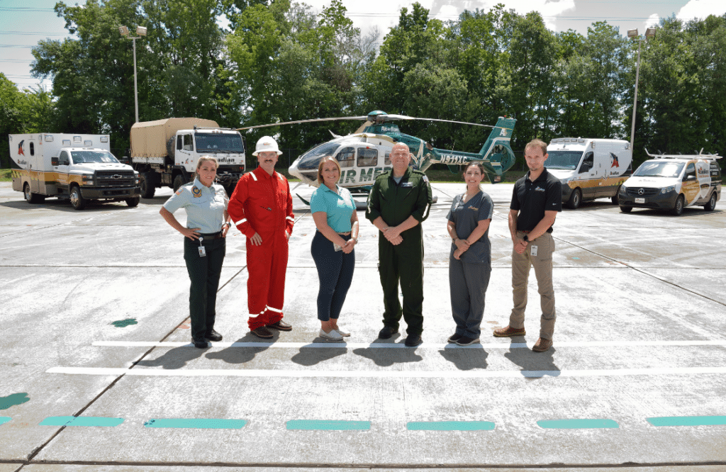 Six Acadian Companies Employees in their divisions' respective uniforms
